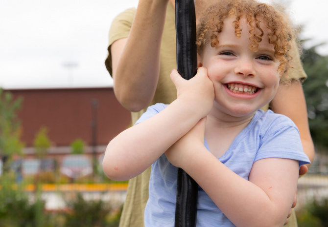 Smiling child and adult